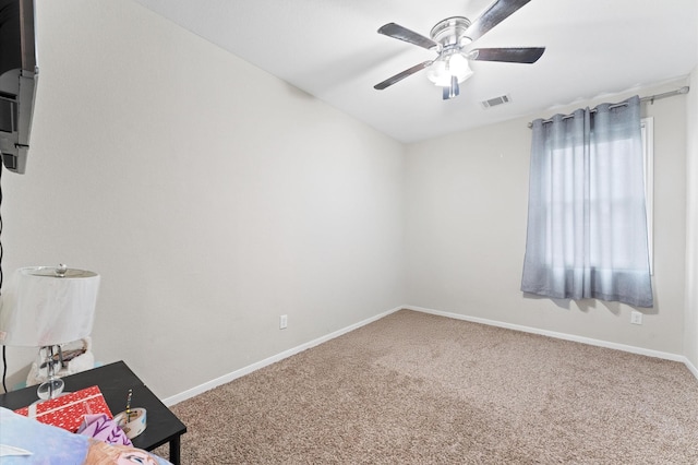 interior space featuring ceiling fan and carpet floors