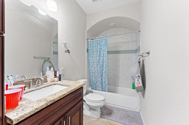 full bathroom featuring vanity, tile patterned floors, toilet, and shower / bath combo