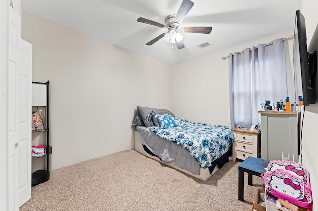 bedroom featuring ceiling fan and carpet flooring