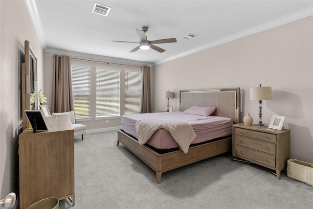 bedroom with light carpet, visible vents, and crown molding