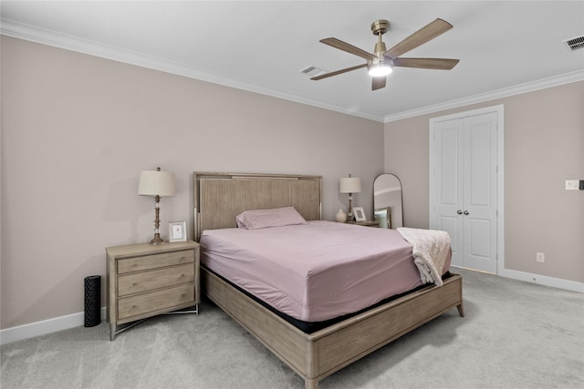 bedroom featuring light carpet, baseboards, visible vents, ornamental molding, and a closet