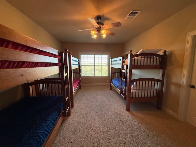 bedroom featuring ceiling fan and carpet flooring