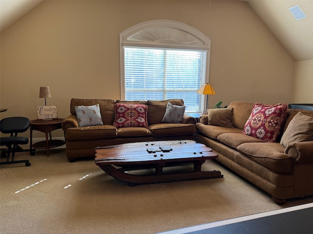 living room featuring vaulted ceiling and carpet floors