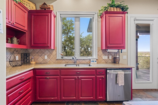1017 Coventry Rd, Spicewood, TX 78669 - kitchen with stainless steel dishwasher, a sink, plenty of natural light, and backsplash