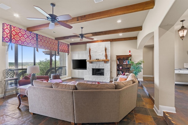 1017 Coventry Rd, Spicewood, TX 78669 - living area featuring baseboards, beamed ceiling, ceiling fan, recessed lighting, and stone tile floors