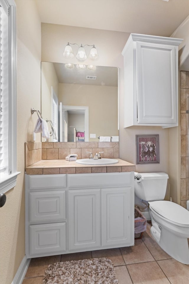 1017 Coventry Rd, Spicewood, TX 78669 - bathroom with toilet, vanity, and tile patterned floors