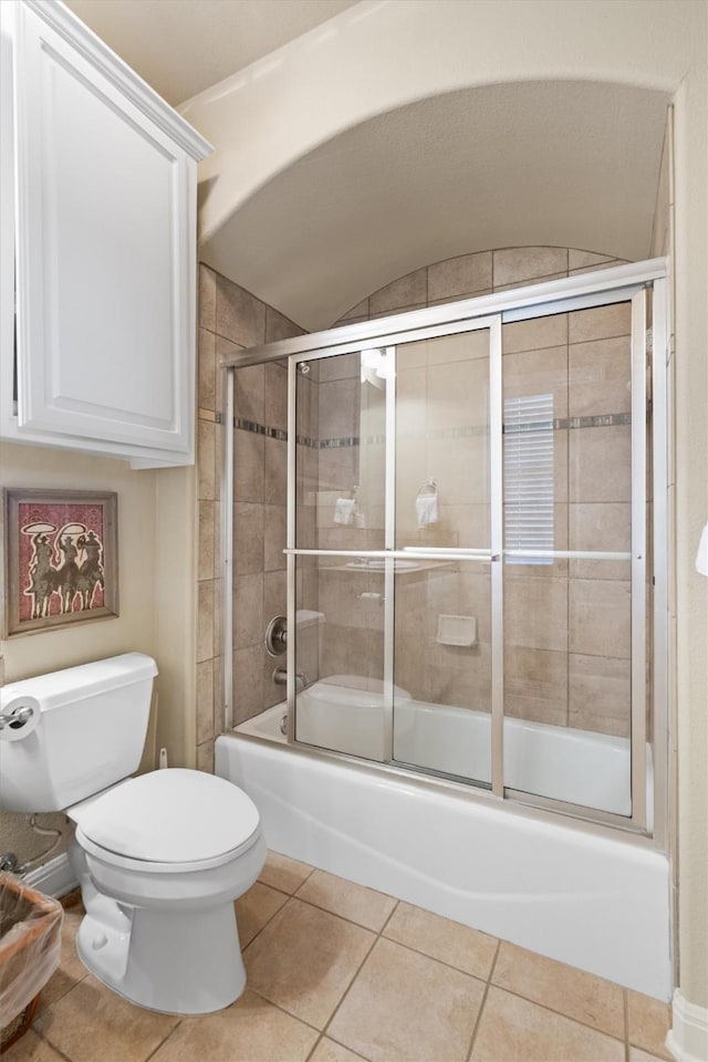 1017 Coventry Rd, Spicewood, TX 78669 - full bathroom with toilet, combined bath / shower with glass door, and tile patterned floors