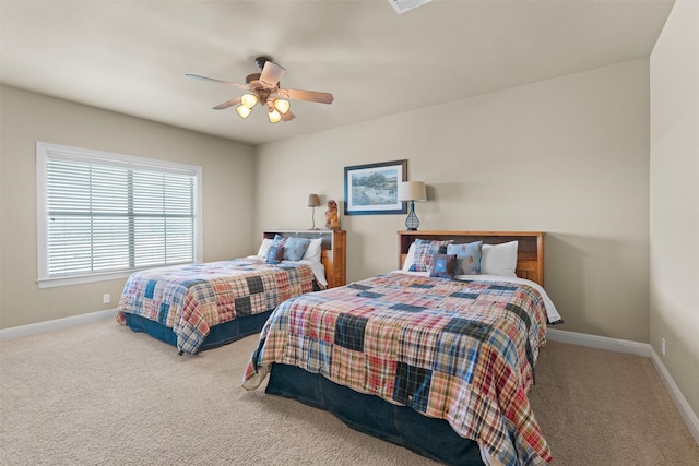 1017 Coventry Rd, Spicewood, TX 78669 - carpeted bedroom with baseboards and a ceiling fan