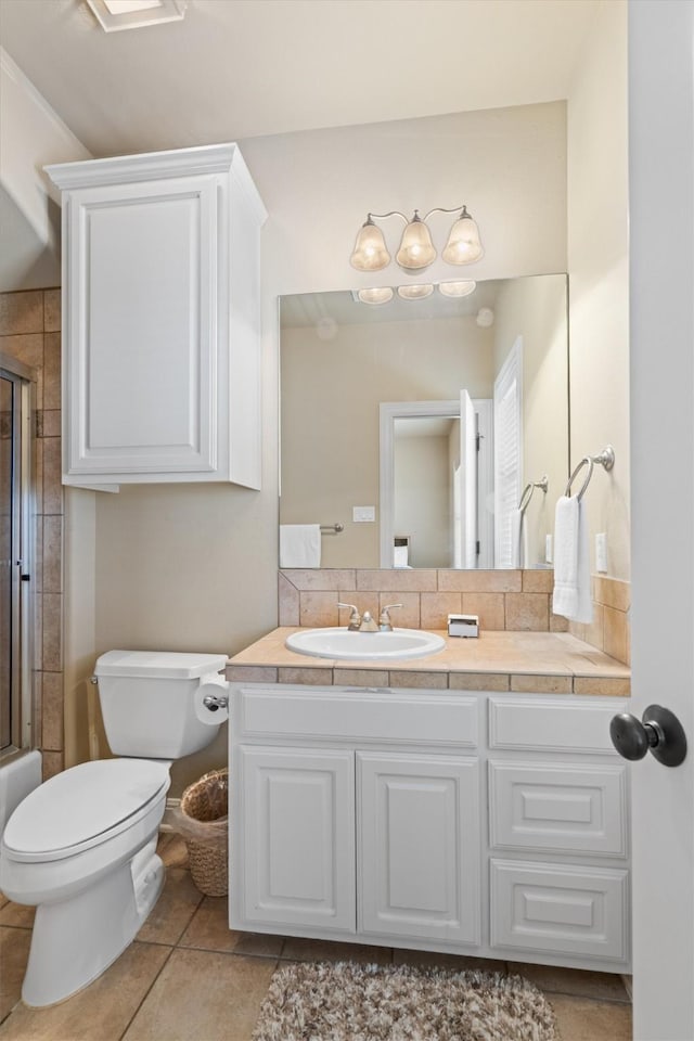 1017 Coventry Rd, Spicewood, TX 78669 - full bathroom featuring toilet, a shower with shower door, vanity, and tile patterned flooring