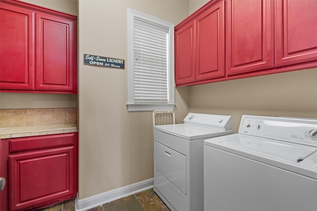 1017 Coventry Rd, Spicewood, TX 78669 - laundry room with washing machine and dryer, baseboards, and cabinet space