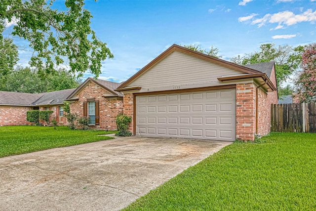 ranch-style home with a garage and a front lawn