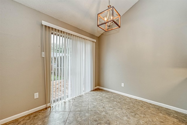 unfurnished dining area featuring an inviting chandelier and tile patterned floors