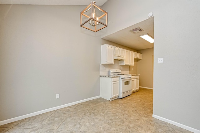 kitchen featuring white cabinetry, hanging light fixtures, an inviting chandelier, tasteful backsplash, and white gas stove