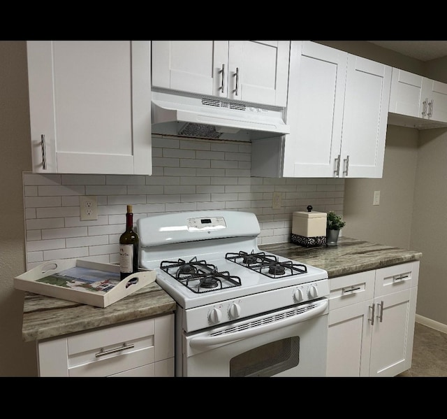 kitchen with white cabinetry, dark stone countertops, backsplash, and white gas range oven