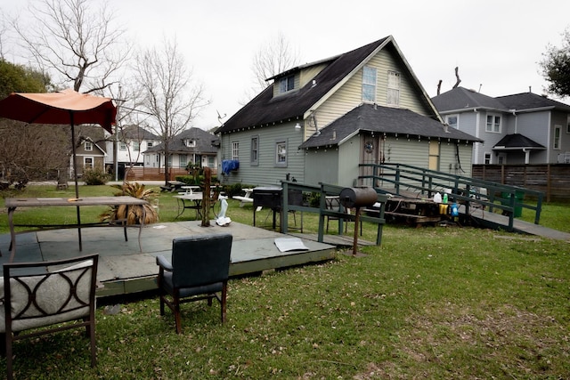 view of home's community featuring a yard and a patio