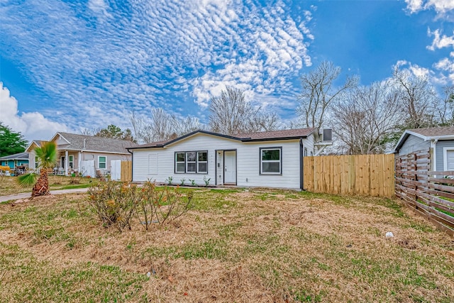 ranch-style house featuring a front lawn