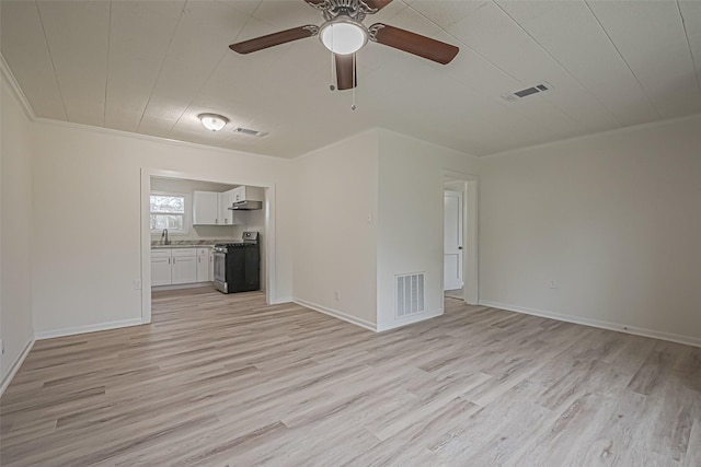 unfurnished living room featuring ceiling fan, light hardwood / wood-style flooring, sink, and crown molding