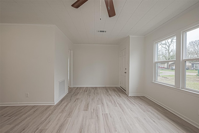 empty room with ceiling fan, light hardwood / wood-style flooring, and crown molding