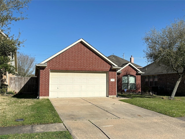 single story home featuring brick siding, an attached garage, a front yard, fence, and driveway