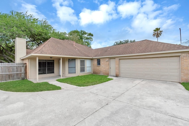 ranch-style house featuring a garage