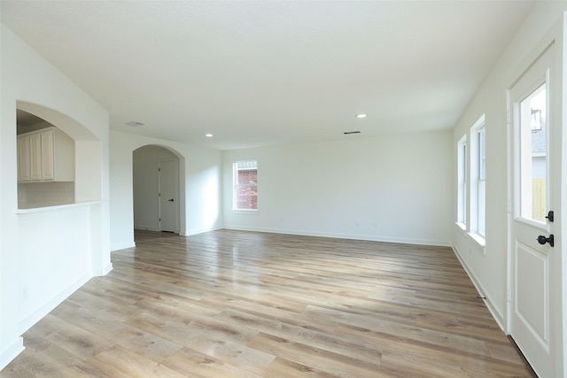 unfurnished room with light hardwood / wood-style floors