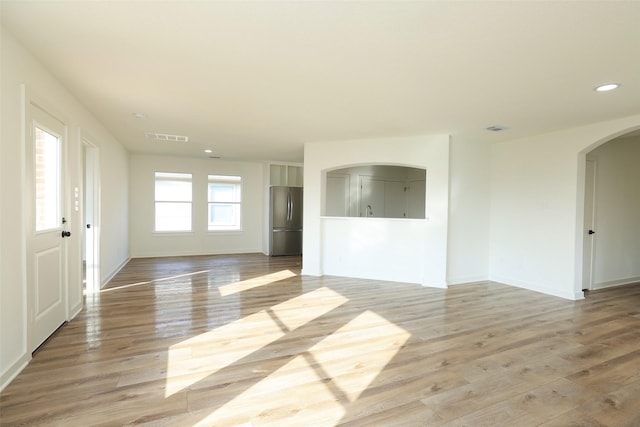 unfurnished living room featuring light hardwood / wood-style floors