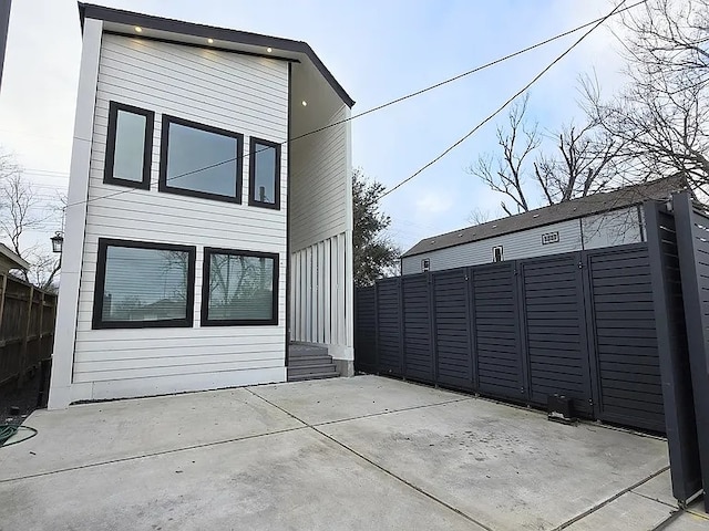 rear view of house featuring a patio