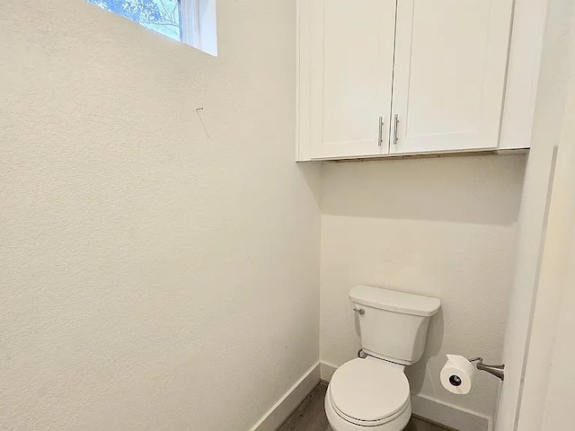 bathroom featuring toilet