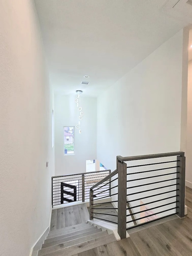 staircase featuring hardwood / wood-style flooring