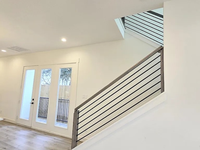 staircase featuring hardwood / wood-style flooring