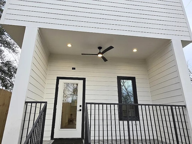 property entrance with ceiling fan