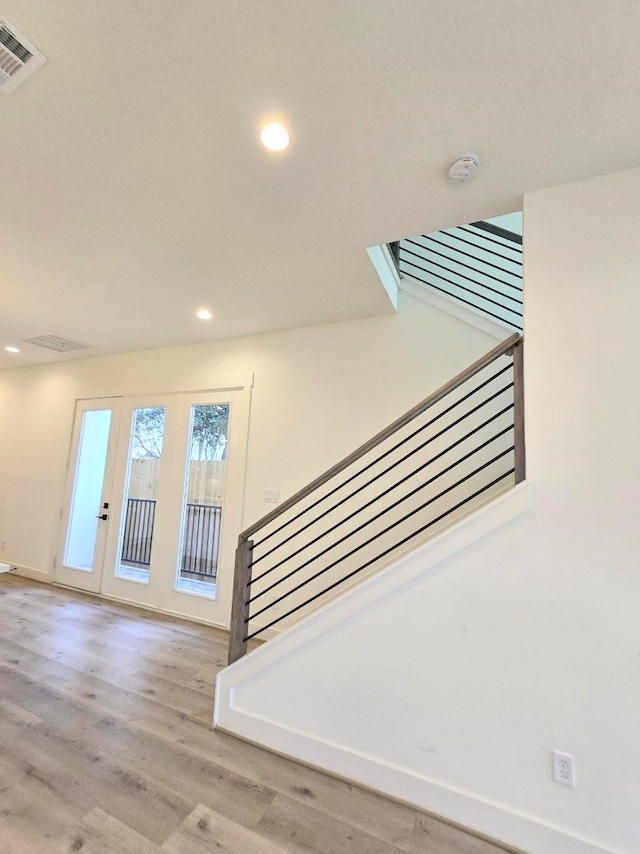 staircase featuring hardwood / wood-style flooring