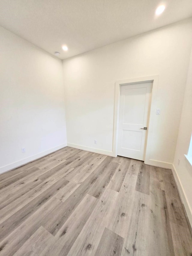 empty room with light wood-type flooring