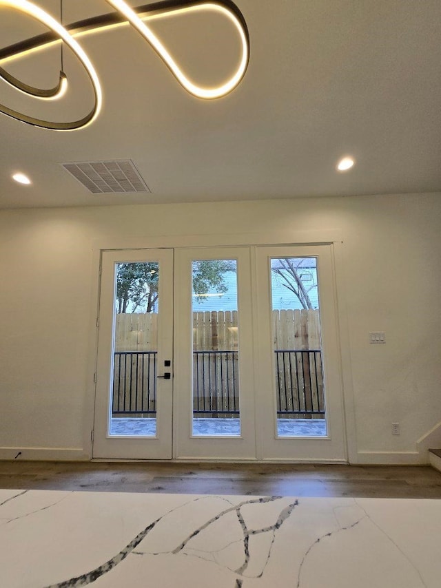 doorway to outside with hardwood / wood-style floors