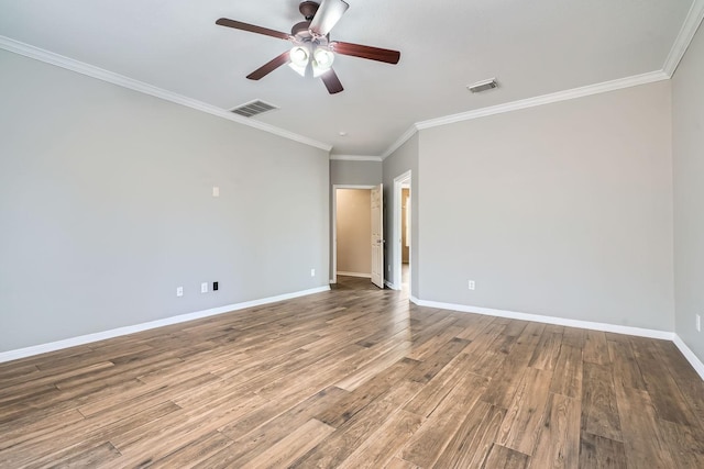 empty room featuring wood-type flooring, ceiling fan, and crown molding