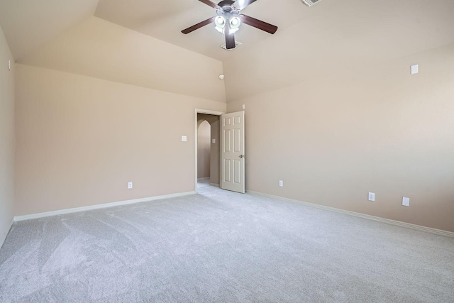 carpeted empty room featuring ceiling fan and lofted ceiling