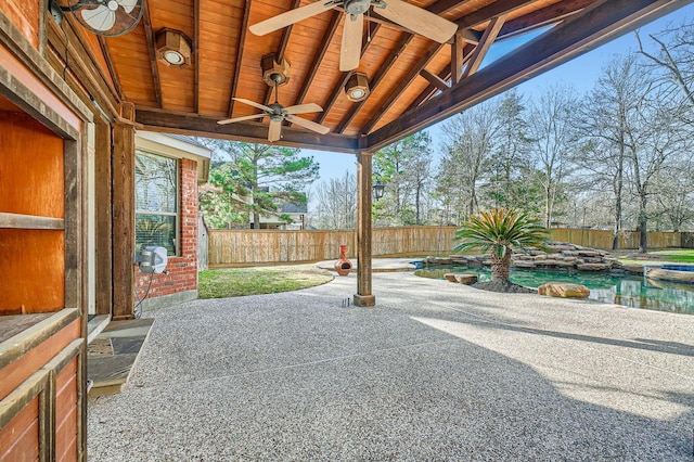 view of patio with a fenced in pool and ceiling fan