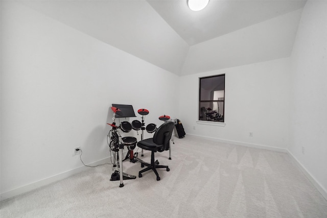 office area featuring lofted ceiling, carpet floors, and baseboards