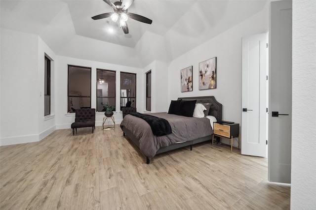 bedroom with ceiling fan, baseboards, and wood finished floors