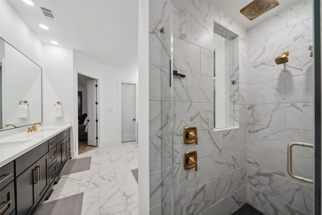 full bath with double vanity, visible vents, marble finish floor, a shower stall, and a sink