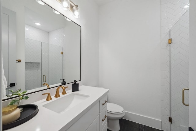 full bath with double vanity, toilet, a stall shower, a sink, and baseboards