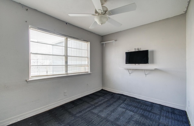 unfurnished room featuring ceiling fan and carpet flooring