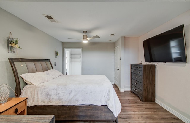 bedroom featuring light hardwood / wood-style flooring and ceiling fan