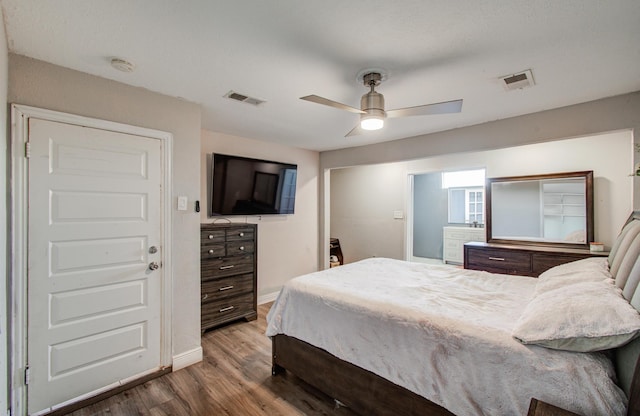 bedroom with ceiling fan and hardwood / wood-style floors