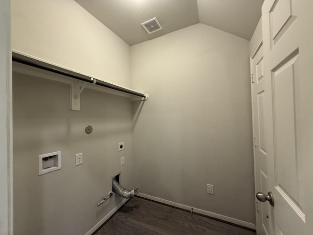 laundry area featuring hookup for a gas dryer, washer hookup, dark hardwood / wood-style floors, and hookup for an electric dryer