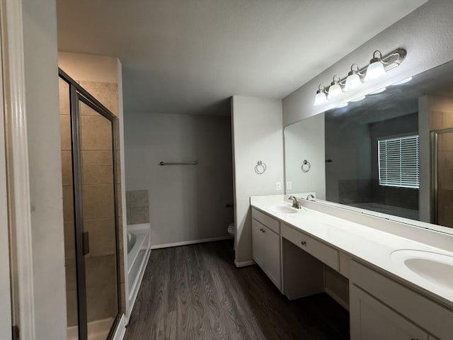 full bathroom featuring vanity, toilet, wood-type flooring, and plus walk in shower