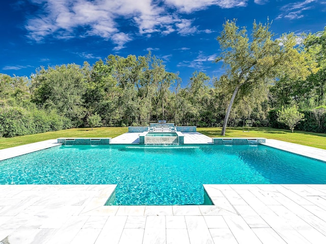 view of swimming pool featuring an in ground hot tub, a patio, and a lawn