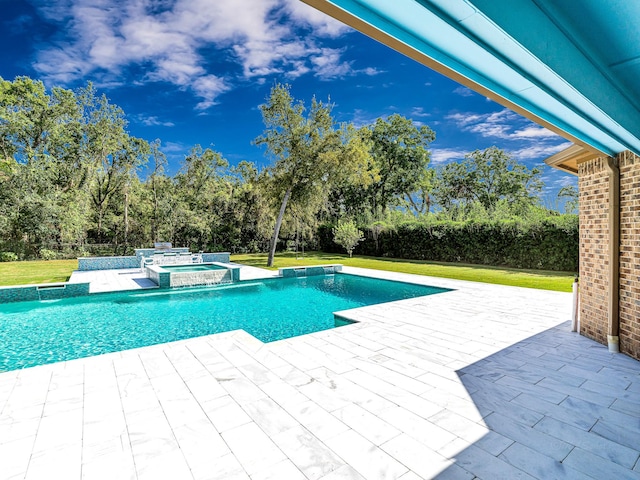 view of swimming pool with a yard, a patio area, and an in ground hot tub