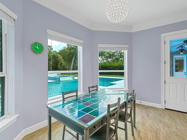 dining room featuring crown molding and an inviting chandelier