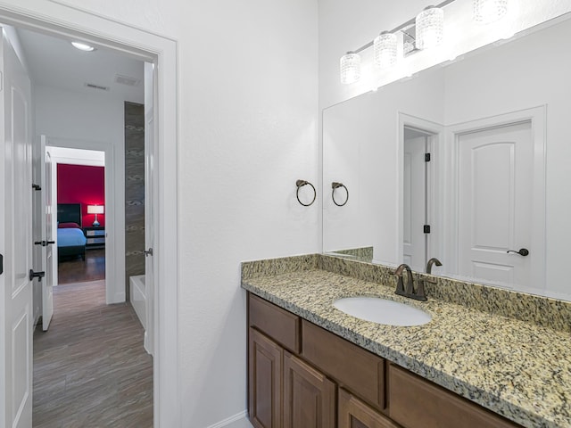 bathroom featuring vanity and wood-type flooring